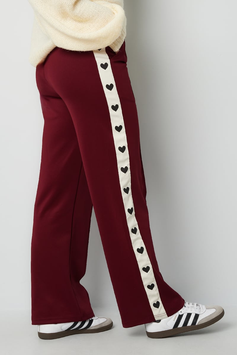 Pants with hearts on the side - red