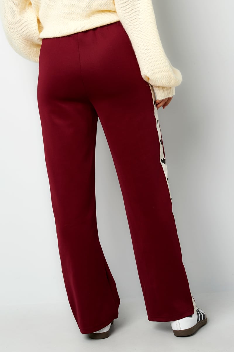 Pants with hearts on the side - red